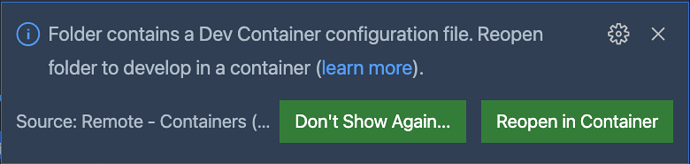 A notification in VS Code saying "Reopen in container"